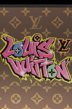 the word louis vuitton is spray painted in pink and green on brown background