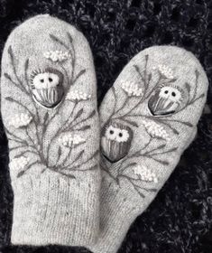 the mitts are decorated with owls and flowers