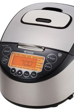 an automatic rice cooker with digital display on the front and side panel showing timers