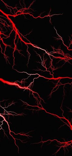 bright red lightning strikes in the dark sky