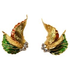 Hand painted Sienna and fern green enamel leaves of sculpted eighteen karat 18K yellow gold create the unique form of these artful vintage earrings. Each is accented with four bright .04 carat H/VS fine round faceted diamonds, .32 carats total weight. Made for pierced ears with post and omega clip, this colorful and abstract pair measures approximately 1-3/8 inch in length by 7/8 wide. Gift boxed. Abstract Earrings, Earrings For Sale, Fern Green, Gold Art, Green Enamel, Jewelry Earrings Studs, Vintage Earrings, Ear Piercings, 18k Gold