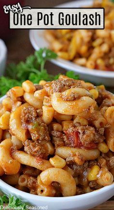 Two bowls full of goulash with parsley in the background. Corn And Ground Beef Recipes, Goulash With Tomato Paste, One Pot Goulash, Goulash With Corn, Best Goulash Recipes, Easy Goulash, Easy Goulash Recipes, Hotdish Recipes, Beef Goulash