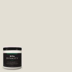 a jar of dymasty color paste on a white background