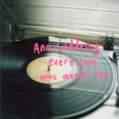 an old record player sitting on top of a table with the words and shaking every song was about you