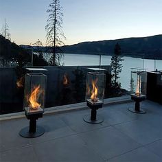 three fire pits sitting on top of a roof