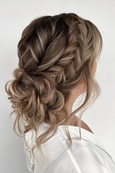 Cascading curls woven into a chic side braid, merging seamlessly into a voluminous low bun for a touch of elegance and romance. // Photo Credit: Instagram @absolutely.ineke.hairstyling Bridesmaid Hair Summer Wedding, Loose Wedding Updos For Long Hair, Bridesmaid Hairstyles For Long Hair Updo, Soft Bridal Updo, Textured Bridal Updo, Bridal Hair Low Updo, Soft Romantic Updo, Bridget Wedding, Moh Hair