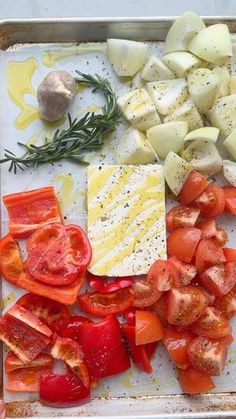 there are many different types of food on the tray together, including potatoes and tomatoes