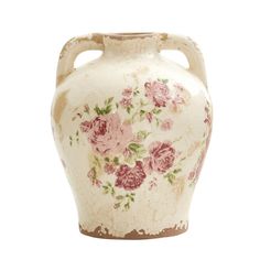 a white vase with pink flowers painted on the side and brown trim around the bottom