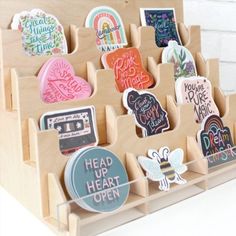 an assortment of magnets in a wooden holder