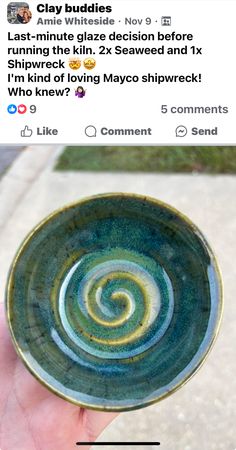 someone is holding up a small bowl with a spiral design on the outside and inside