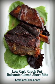 a close up of a plate of food with meat and lettuce on it