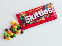 skittles candy bar on white background with colorful candies