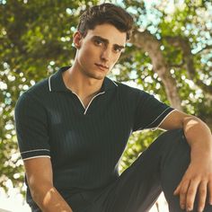 Crafted in a durable blend of cotton and polyester, this rib-stitch short-sleeved polo sweater showcases a solid flat knit Johnny collar, armbands, and waist. Soft against the skin with comfort stretch and added strength for lasting wear, it strikes the perfect balance between comfort and durability. Fitted Navy Polo Sweater With Ribbed Collar, Navy Short Sleeve Polo Sweater With Ribbed Collar, Fitted Ribbed Short Sleeve Polo Shirt, Casual Short Sleeve Polo Shirt With Ribbed Cuffs, Black Short Sleeve Polo Sweater With Ribbed Collar, Casual Short Sleeve Polo Sweater With Seamless Collar, Casual Fitted Polo Shirt With Ribbed Cuffs, Fitted Ribbed Polo Shirt, Fitted Knit Polo Sweater With Short Sleeves