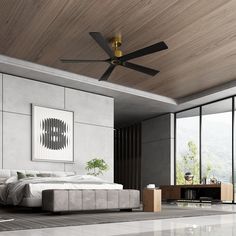 a bedroom with a large bed and a ceiling fan in the middle of the room