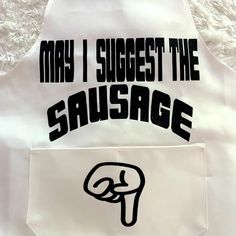 an apron with the words may i suggest the sausage in black ink on white fabric