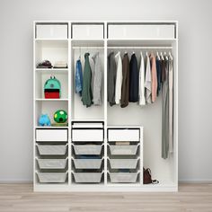 a white closet filled with lots of clothes and bins next to a wooden floor