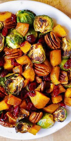 brussel sprouts and brussels sprouts with cranberry sauce in a white bowl