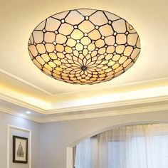 a living room with a round light fixture