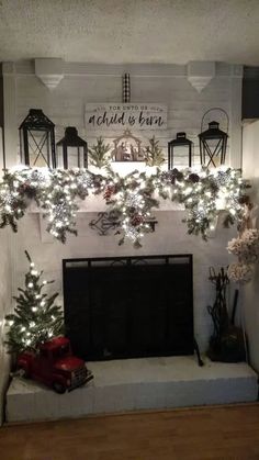 a fireplace decorated with christmas decorations and lights