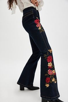 So fun and flared, these Driftwood jeans will turn heads with every wear. **Fit:** High-rise, true flare silhouette **Features:** Zip fly and button closure, floral embroidery throughout, back yoke seam for added shape, soft stretch denim **Why We ❤ It:** Timeless with western boots or off-duty with sneakers, this pair has endless ways to wear. | Driftwood Veda Flare Jeans at Free People in Dark Wash, Size: 27 Fall Floral Embroidered Wide Leg Jeans, Casual Embroidered Flare Jeans In Denim Blue, Embroidery Pants Jeans, Spring Floral Embroidery Wide Leg Flare Jeans, Wide Leg Denim Flare Jeans With Floral Embroidery, Embroidered Denim Blue Cotton Flare Jeans, Embroidered Wide Leg Denim Flare Jeans, Fitted Mid-rise Embroidered Flare Jeans, Spring Floral Embroidered Flare Denim Jeans