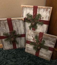 two wooden boxes with christmas decorations on them