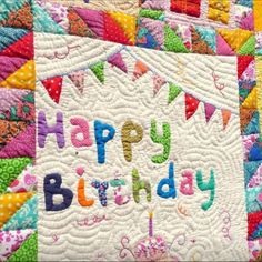 a birthday quilt with the words happy birthday on it