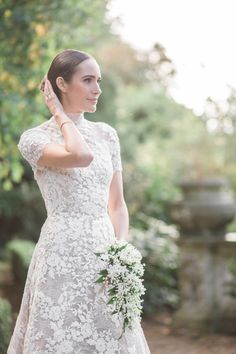 a woman in a wedding dress is talking on her cell phone