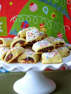 a white platter filled with pastries on top of a table