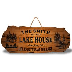 a wooden sign that says the smith lake house is better at the lake on it