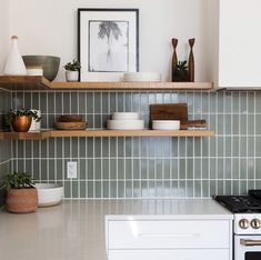 the kitchen counter is clean and ready to be used as a shelf above the stove