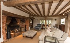 a living room filled with furniture and a fire place