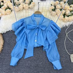 Chiffon Ruffle Top For Party, Chiffon Party Top With Ruffles, Trendy Party Blouse With Ruffle Hem, Office Shirt With Ruffled Collar And Details, Elegant Ruffled Shirt For Spring, Blue Pleated Tops For Summer, Blue Pleated Summer Tops, Spring Party Blouse With Ruffle Sleeves, Chiffon Blouse For Party