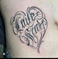 a man's stomach with the word love written in cursive writing