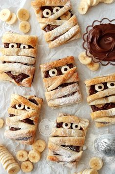 banana and chocolate filled pastries with googly eyes, bananas and other food items