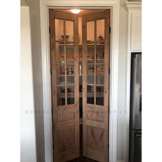 an open wooden door in a kitchen