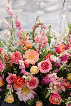 a bunch of flowers that are sitting on a table