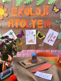 the bulletin board is decorated with paper cut outs and flowers, carrots, and butterflies