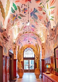 the hallway is decorated with an elaborate mural