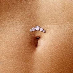 Introducing our stunning Belly Button Ring, a true beauty in navel piercing jewelry. Crafted with precision from ASTM F136 G23 Implant Grade Titanium, this exquisite piece is perfect for both women and men (unisex). This Threadless Floating Convex Base Belly Button Ring features 5 Round Bezel Set Cubic Zirconia, adding a touch of brilliance to your look. With a 14 Gauges (1.6mm) thickness and a comfortable 5/16" (8mm) length, it promises an enjoyable wear. Choose from a range of captivating colo Summer Belly Button Rings, Belly Button Piercing Cute, Button Tattoo, Mid Finger Rings, Navel Piercing Jewelry, Bellybutton Piercings, Titanium Belly Ring, Belly Button Piercing Jewelry, Belly Button Jewelry