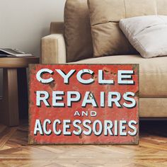 a red sign that says cycle repairs and accessories