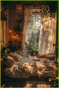 an unmade bed in front of a window filled with plants