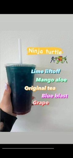 a hand holding a blue drink with the words ninja turtle on it's side