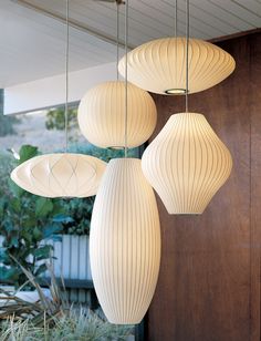 three white lamps hanging from the ceiling