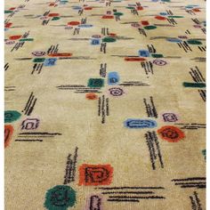 an area rug with different colored designs on it