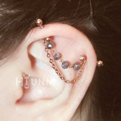 Model is shown wearing Rose Gold 16g 8X8mm bars [ Color Options ] Silver, Gold, Rose Gold Crystals: Pastel, Ocean, Anthracite, Seafoam Opal, Sky Grey, Navy [ Bar, Ball Options] Bar thickness: 16gauge, 14gauge Bar length: 1/4″(6mm), 5/16″(8mm), 3/8″(10mm) Ball ends sizes: 3mm, 4mm [ Materials ] Chain, Jump-rings: Ion gold plated 304 stainless steel Barbell: 316l surgical steel 18k gold plated jump rings Crystals [ Measurement ]  - Chain length:  1.2″ (30mm), 1″(25mm) √ Please contact us directly Industrial Piercing Ear Stack, Crystal Industrial Piercing, Girly Industrial Piercing, Dangle Industrial Piercing, Industrial Piercing Chain Jewelry, Faux Industrial Piercing Chain, Helix Chain Piercing, Piercings Ear Industrial, Unique Industrial Piercing Jewelry