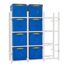 a white shelving unit with six blue bins