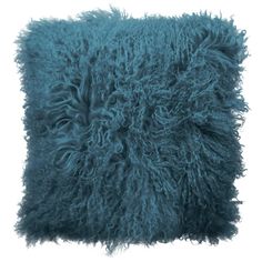 a blue shaggy pillow on a white background