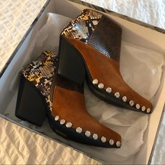 These Color Blocked Boots Are A Dream But I Tried Them On Once And They’ve Been In The Box Since. Perfect Cowgirl-Esque Shoes For A Night Out! Comes With Extra Studs (Third Pic) And Dust Bags 3” Heel Height/ Leather+Suede Upper Unfortunately The Top Of The Box Is A Bit Banged Up, I Will Fix It Up The Best I Can Before Shipping Out! Brown Snip Toe Booties For Fall, Brown Pointed Toe Moto Boots With Leather Sole, Black Leather Cowgirl Outfit, Brown Snip Toe Heeled Boots With Stacked Heel, Brown Moto Boots With Stacked Heel And Snip Toe, Trendy Brown Booties With Block Heel, Brown High Heel Boots With Contrasting Heel Counter, Brown Pointed Toe Boots With Contrasting Heel, Brown Snip Toe Boots With Stacked Heel