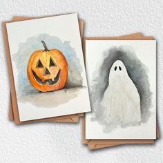 two halloween cards with watercolor drawings of ghost and jack - o'- lantern