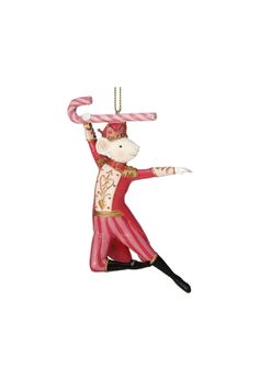 a glass ornament with a monkey on it's head and arms in the air